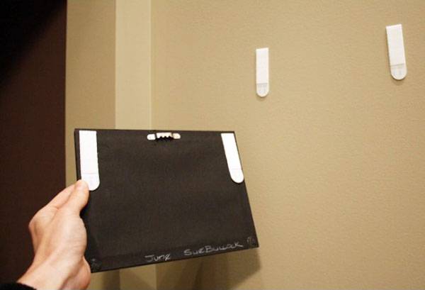 Fermoirs muraux de commande pour tableaux