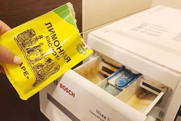 Ajout d'acide citrique au plateau de la laveuse