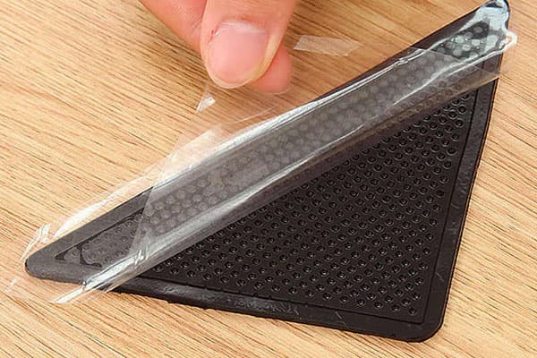 Coin en caoutchouc pour tapis